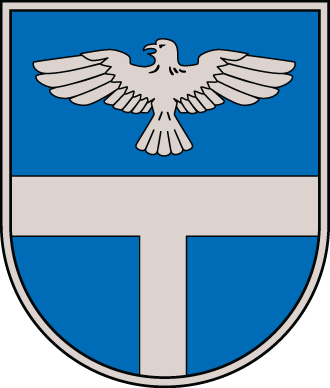 Coat of arms featuring a blue shield with a silver horizontal bar and an eagle, symbolizing heritage and identity.